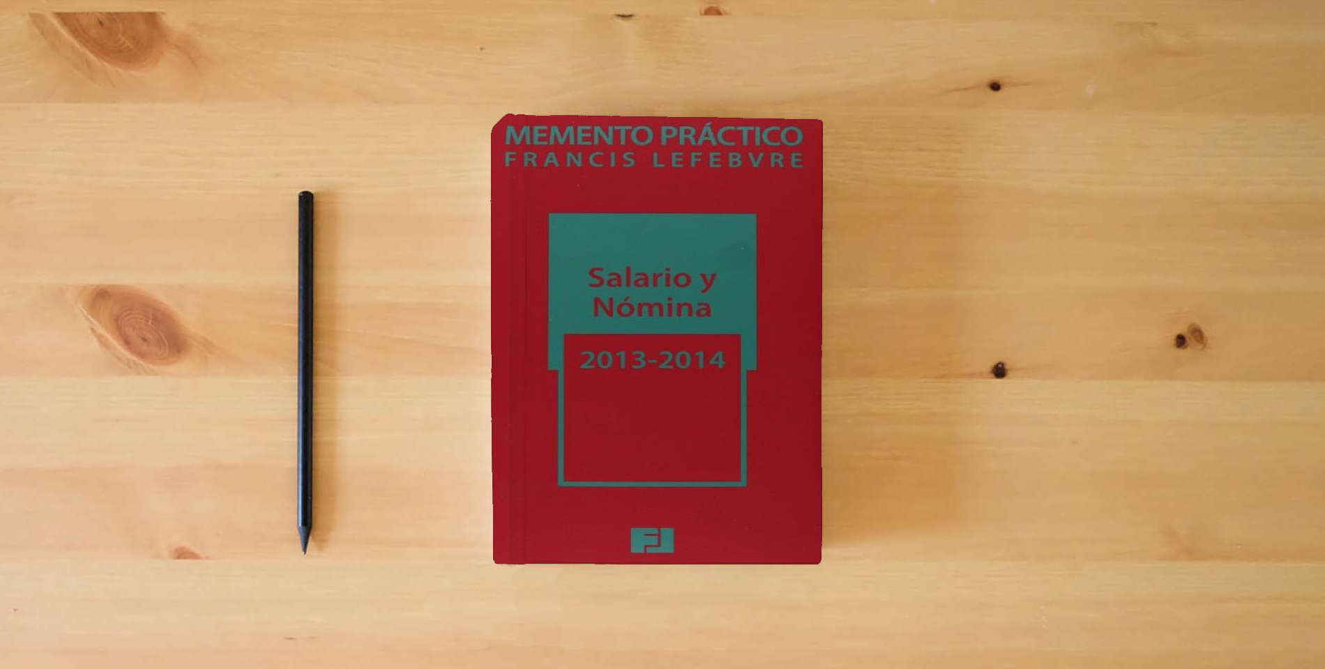 The book Memento práctico salario y nómina 2013-2014 is on the table