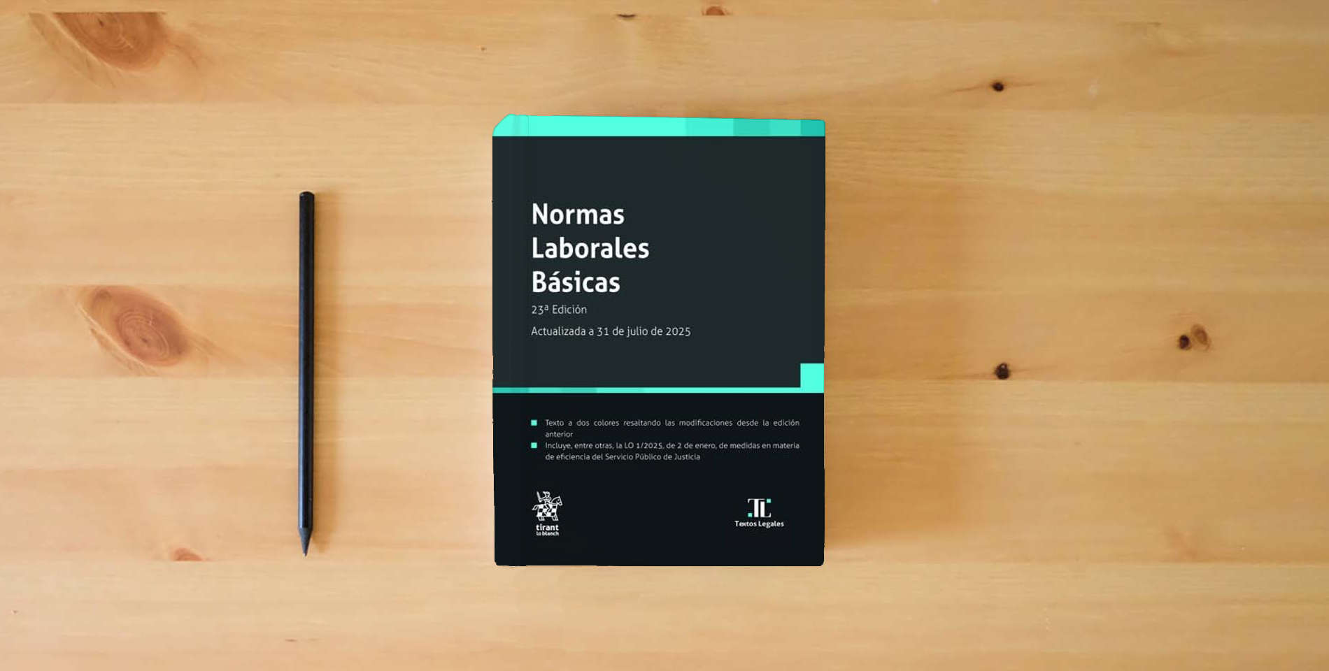 The book Normas Laborales Básicas 23ª Edición. Actualizada a 31 de julio de 2025 is on the table