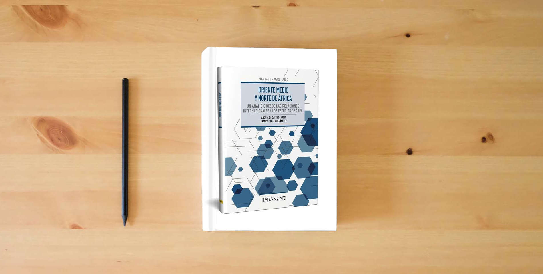 The book Oriente Medio y Norte de África: un análisis desde las Relaciones Internacionales y los Estudios de Área (Manuales) is on the table