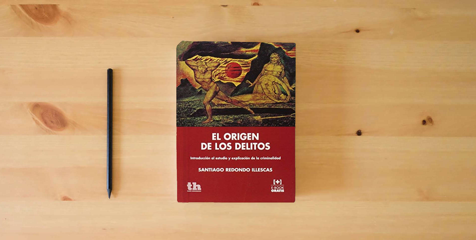 The book El Origen de los Delitos (Plural) is on the table