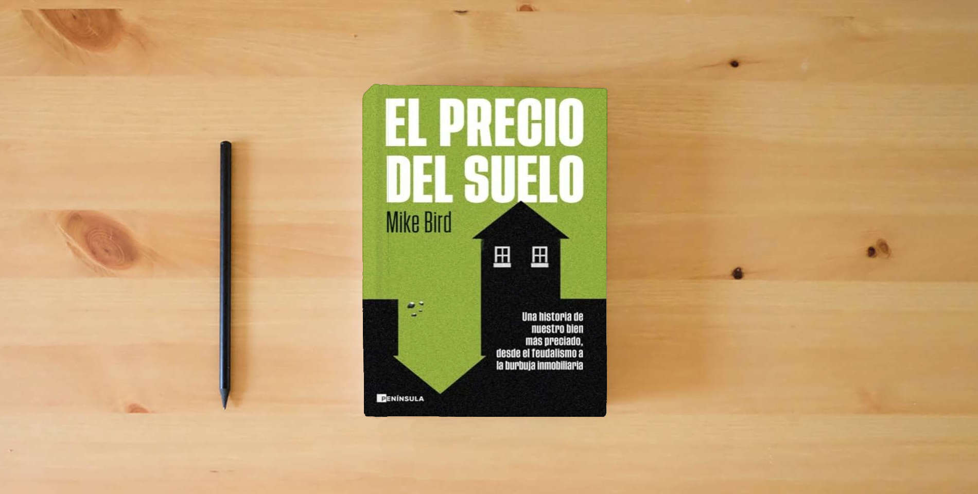 The book El precio del suelo: Una historia de nuestro bien más preciado, desde el feudalismo a la burbuja inmobiliaria (ACTUALIDAD) is on the table