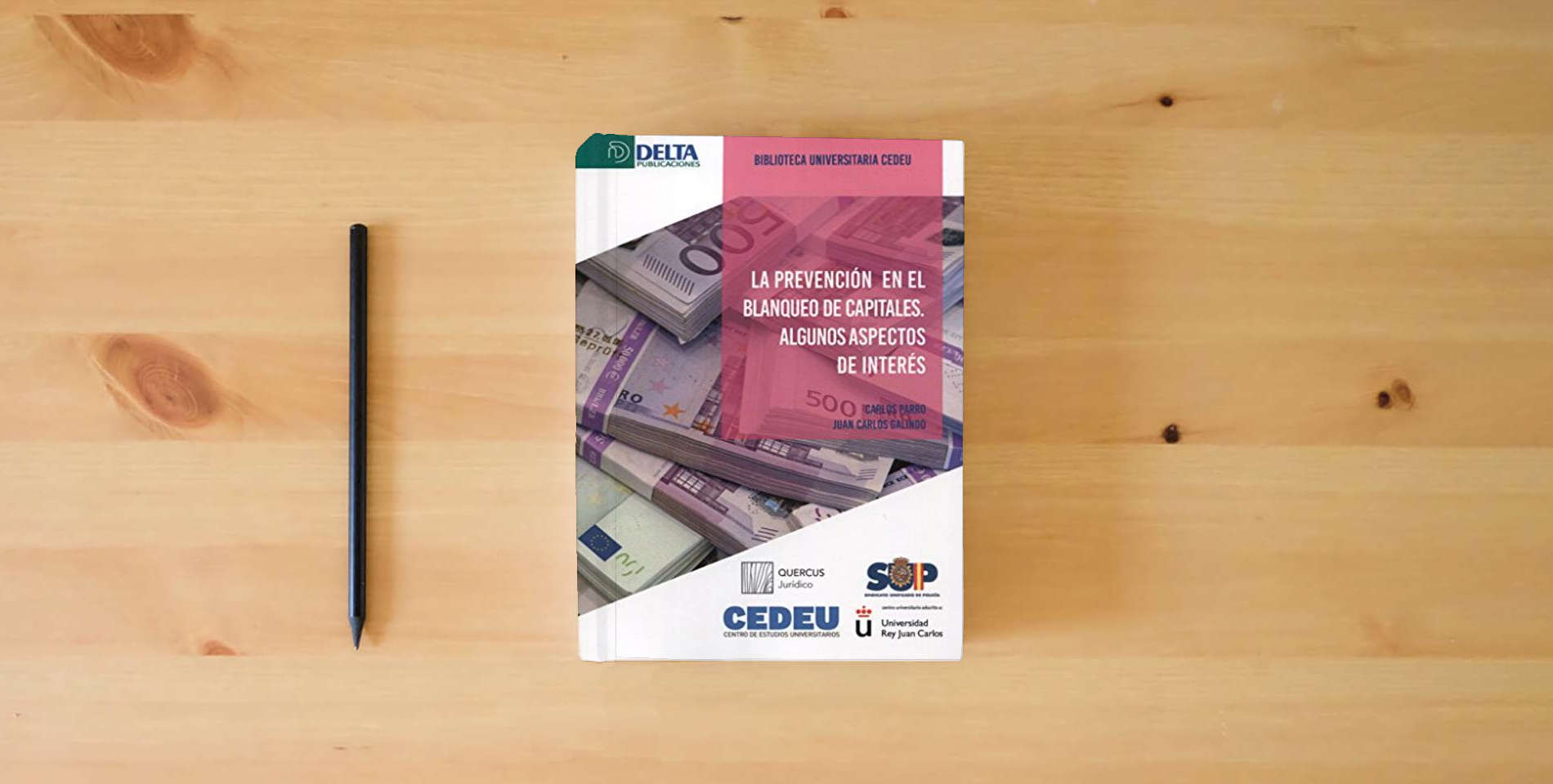 The book LA PREVENCIÓN DEL BLANQUEO DE CAPITALES: Algunos aspectos de interés (DELTA) is on the table