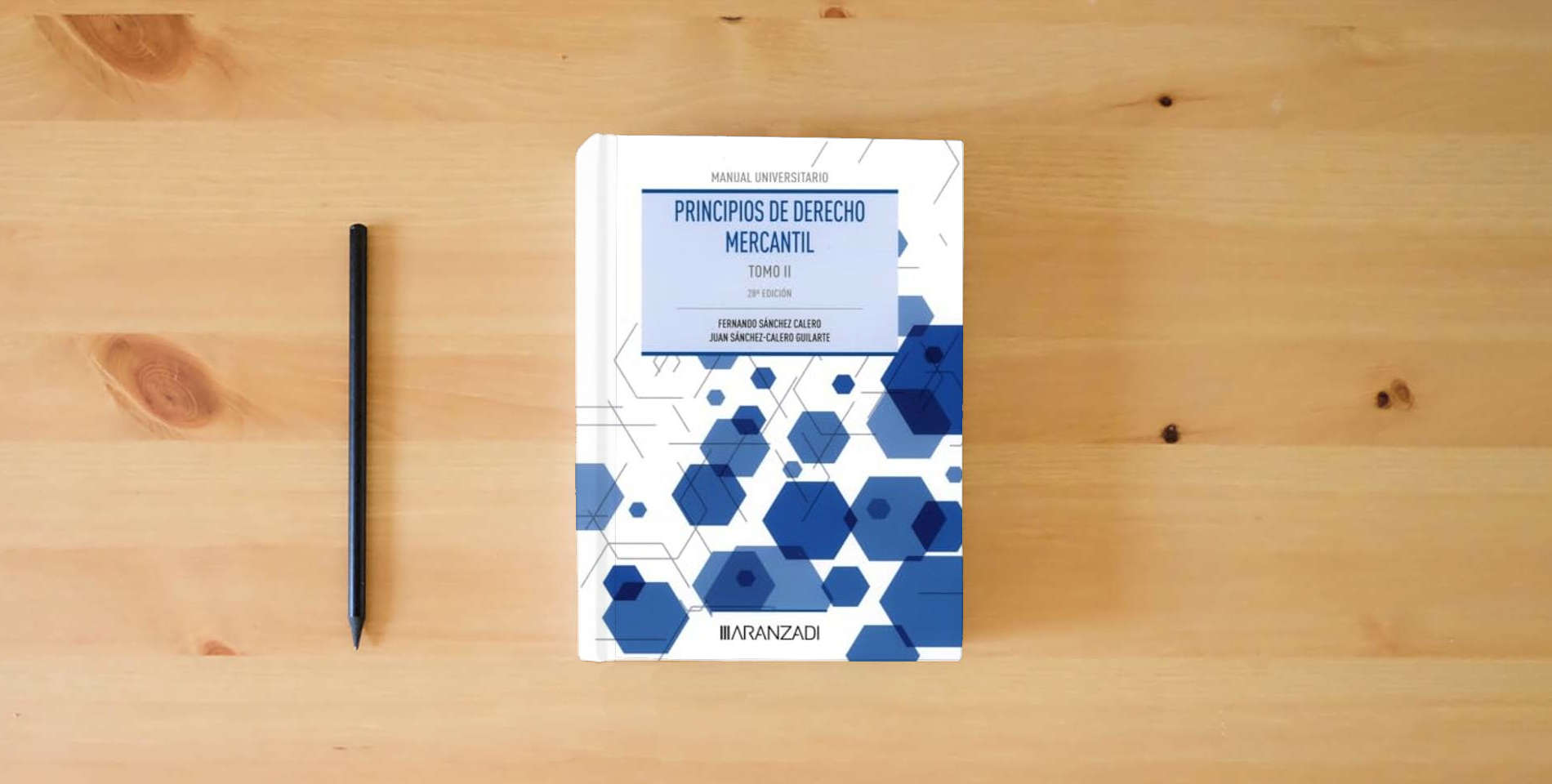 The book Principios de Derecho Mercantil (Tomo II) (Manuales) is on the table