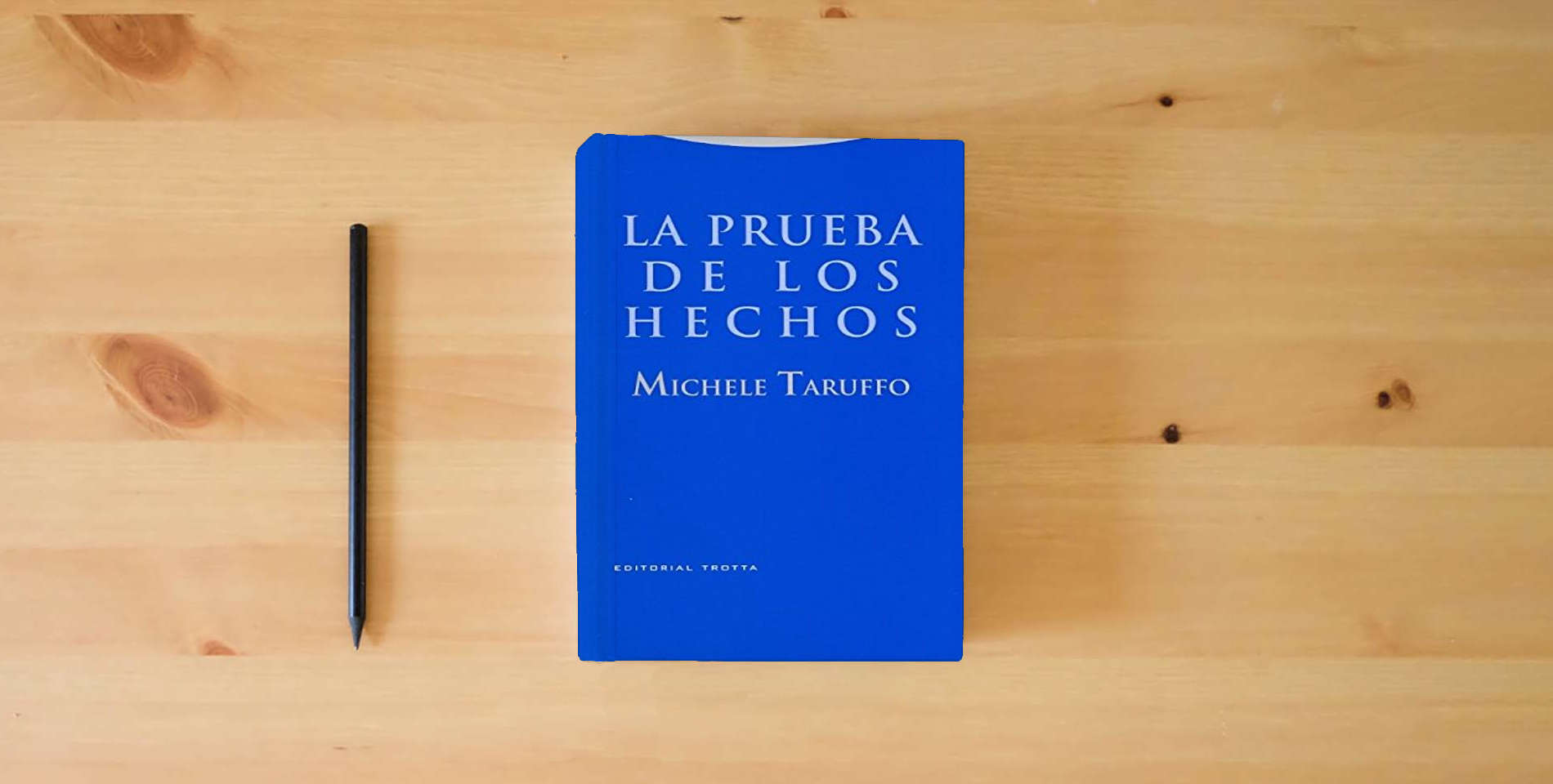 The book La Prueba De Los Hechos (ESTRUCTURAS Y PROCESOS - DERECHO) is on the table