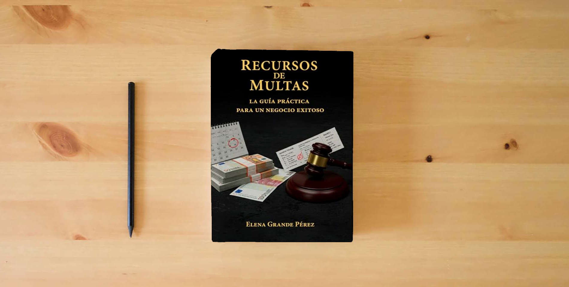 The book Recursos de Multas: La Guía Práctica para un Negocio Exitoso is on the table