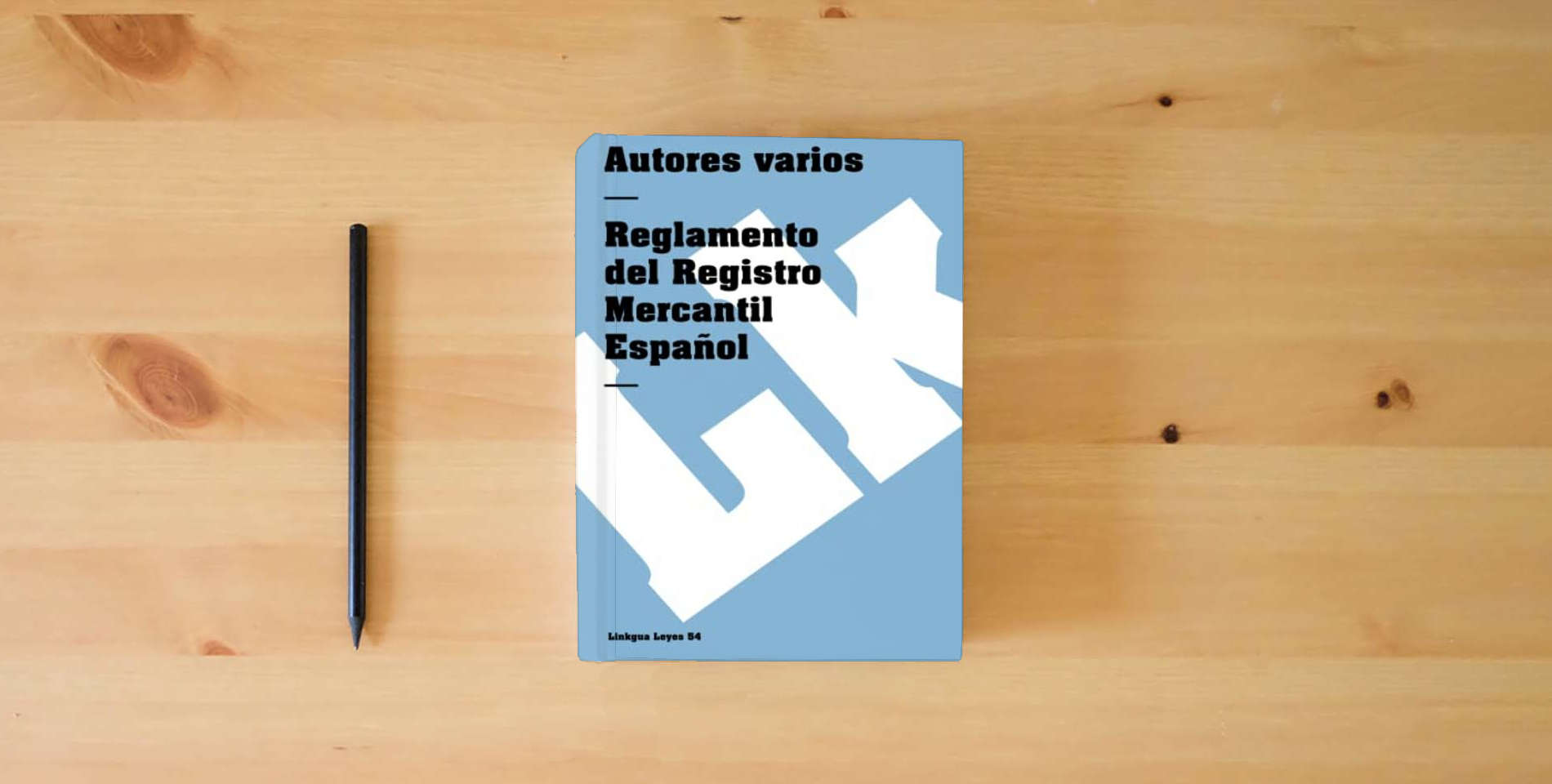 The book Reglamento del Registro Mercantil Español: 54 (Leyes) is on the table