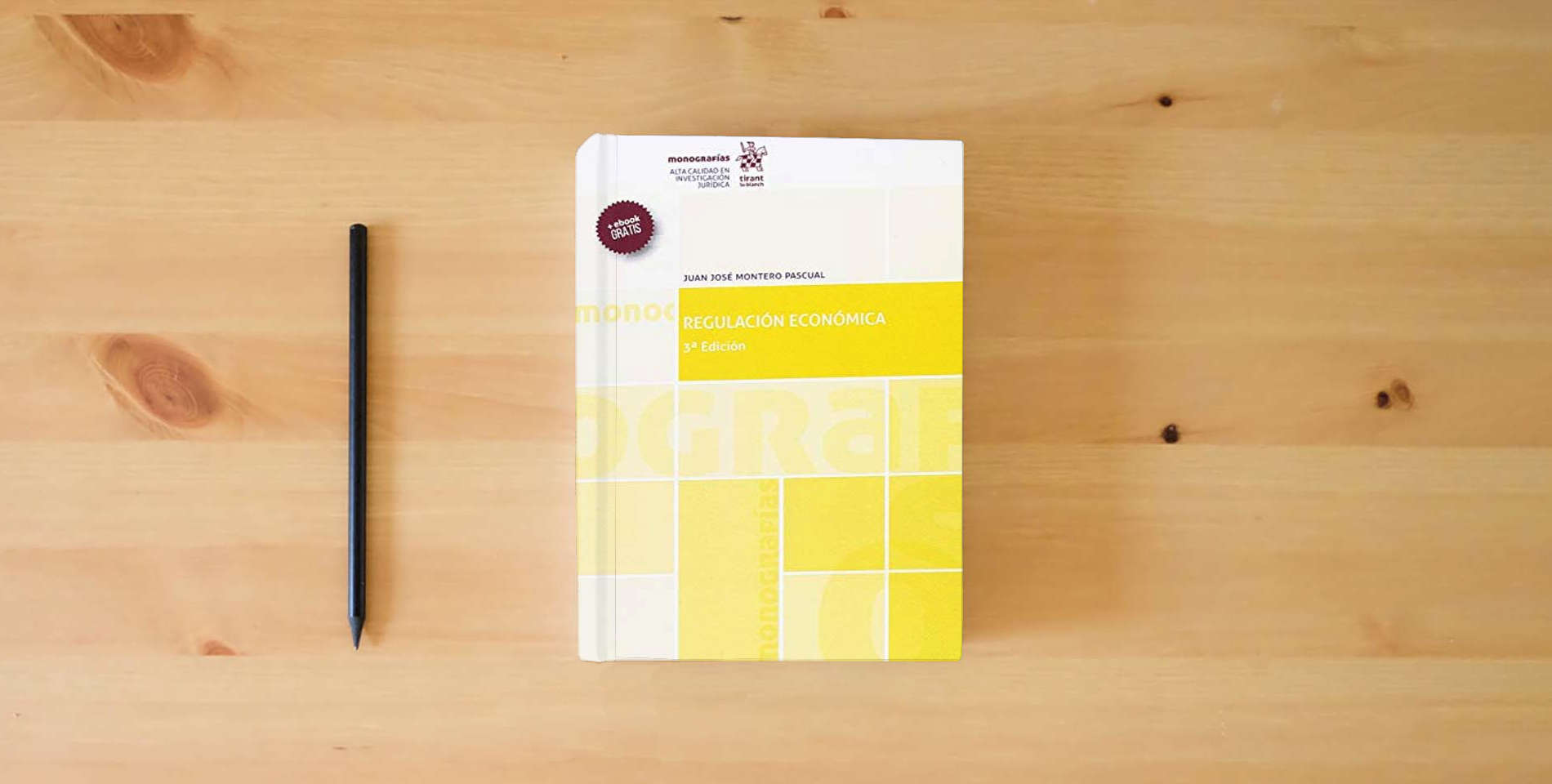 The book Regulación Económica 3ª Edición 2018 (Monografías) is on the table