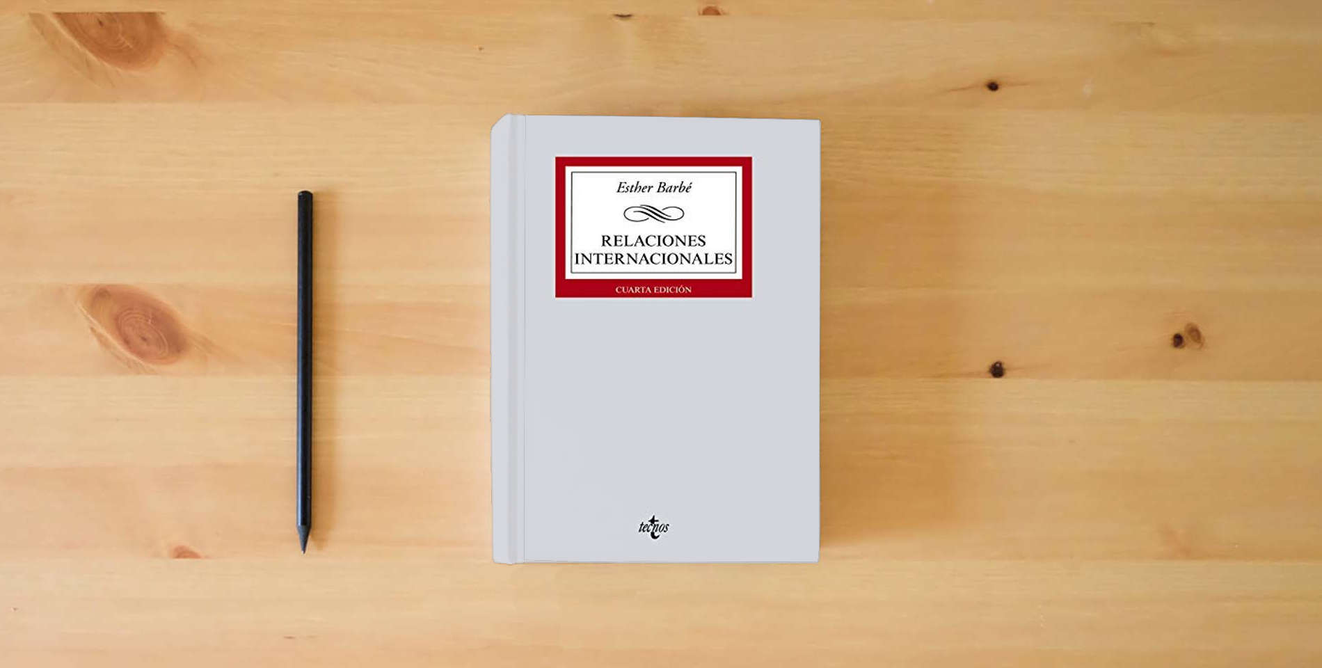 The book Relaciones internacionales (Derecho - Biblioteca Universitaria de Editorial Tecnos) is on the table