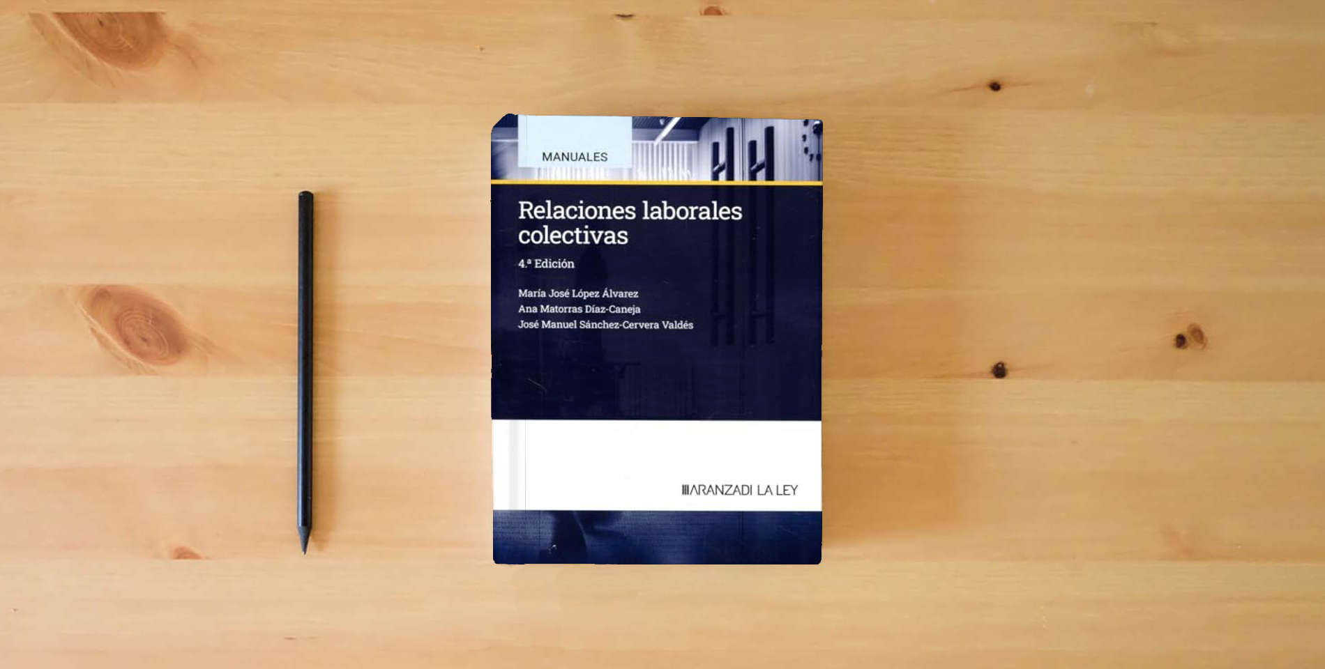 The book Relaciones laborales colectivas (Manuales) is on the table