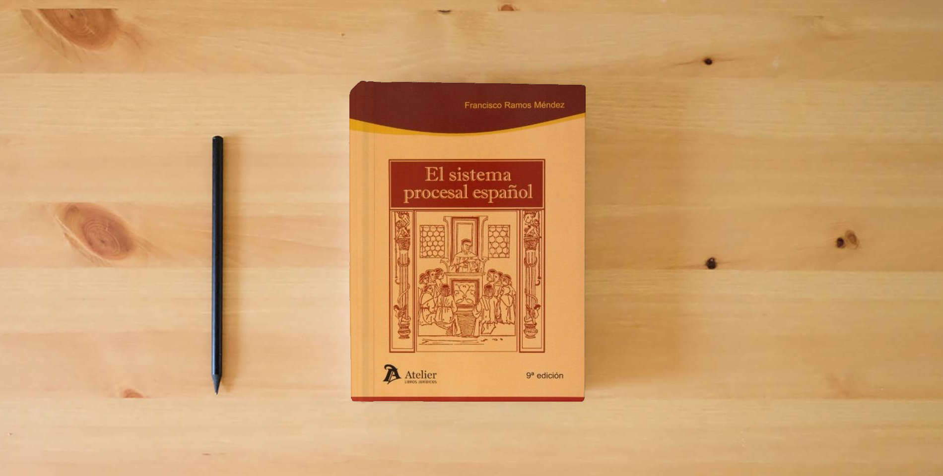 The book Sistema procesal español. 9ª edición. (Processus Iudicii) is on the table