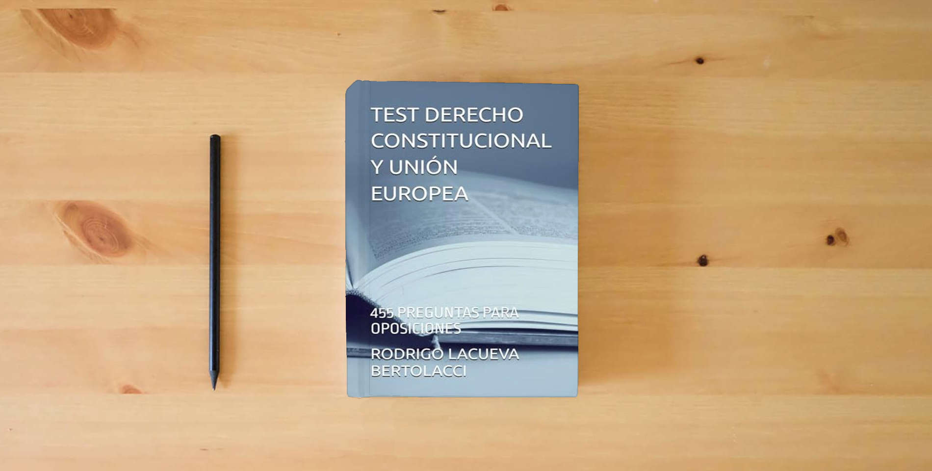 The book TEST DERECHO CONSTITUCIONAL Y UNIÓN EUROPEA: 455 PREGUNTAS PARA OPOSICIONES is on the table