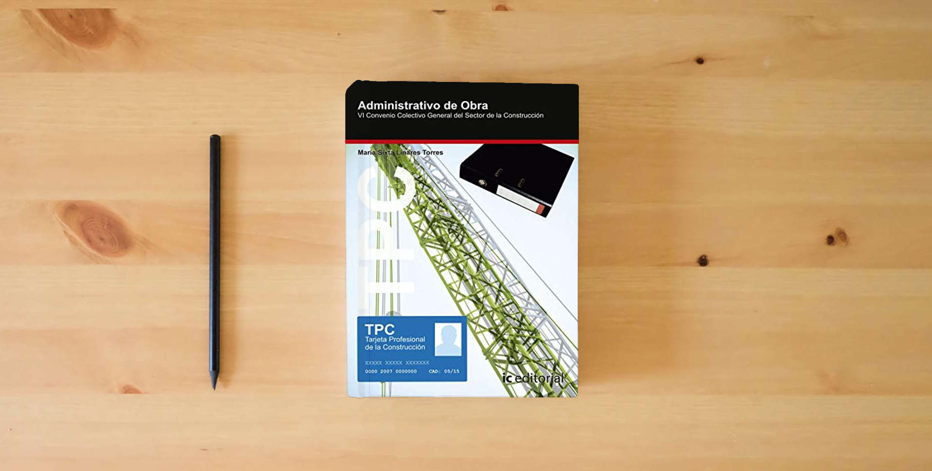 The book TPC - Administrativo de obra (SIN COLECCION) is on the table
