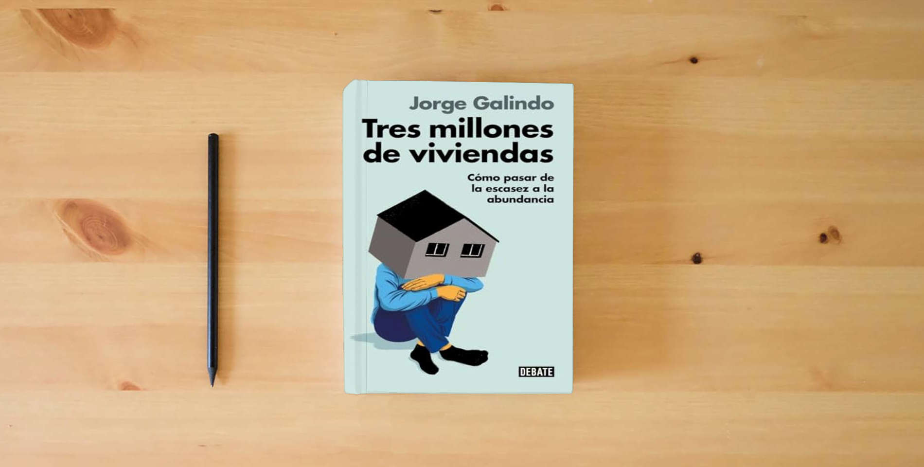 The book Tres millones de viviendas: Cómo pasar de la escasez a la abundancia (Ensayo y Pensamiento) is on the table