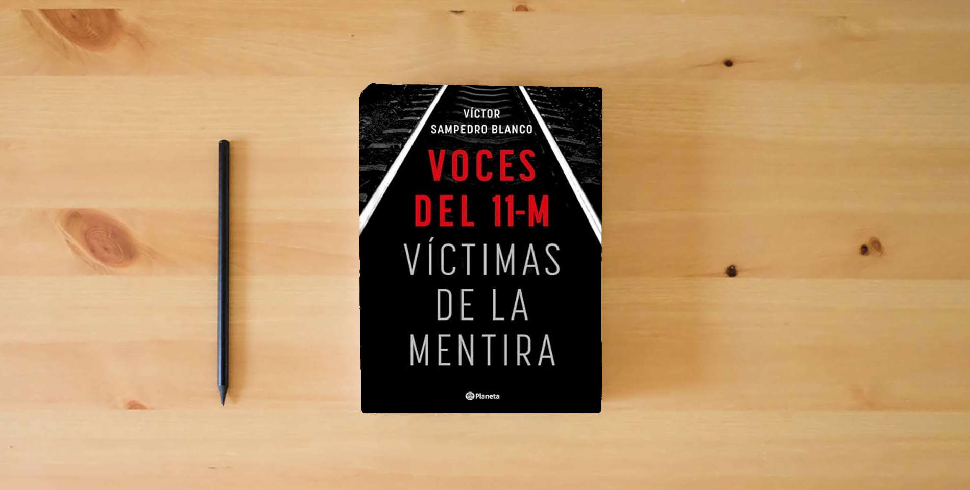 The book Voces del 11-M: Víctimas de la mentira (No Ficción) is on the table