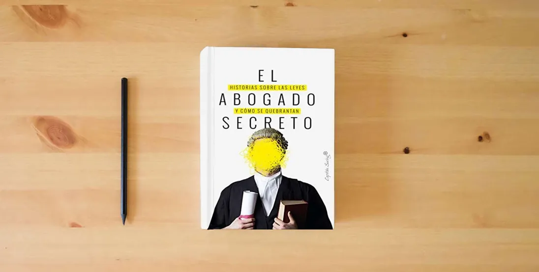 The book El abogado secreto: Historia sobre las leyes y cómo se quebrantan. (ENSAYO)} is on the table
