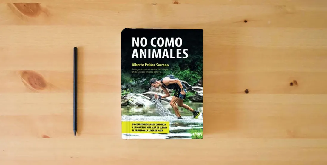 The book No como Animales: 5 (Conciencia)} is on the table