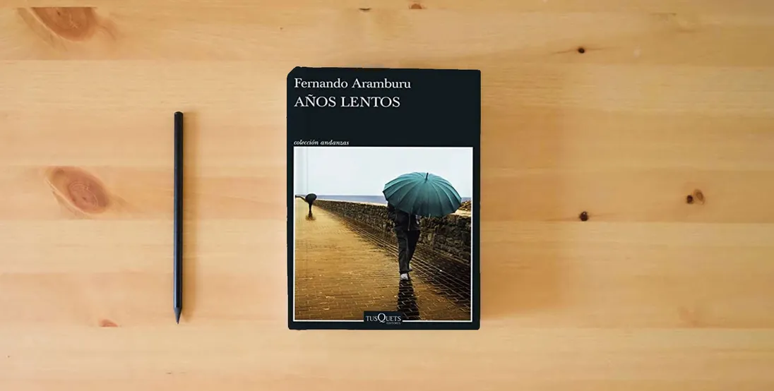 The book Años lentos (Andanzas)} is on the table
