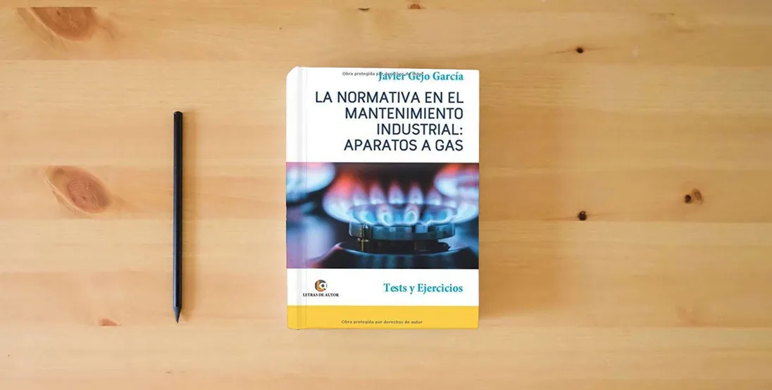 The book APARATOS A GAS. LA NORMATIVA EN EL MANTENIMIENTO INDUSTRIAL.: Tests y Ejercicios.} is on the table