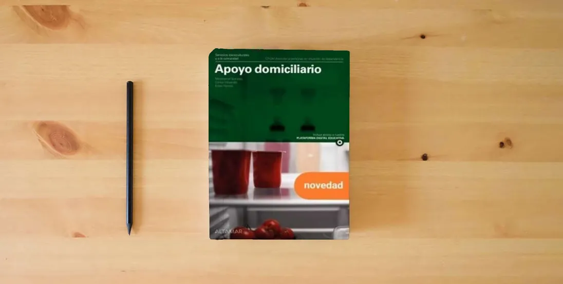 The book Apoyo domiciliario. Nueva edición. (CFGM ATENCIÓN A PERSONAS EN SITUACIÓN DE DEPENDENC)} is on the table