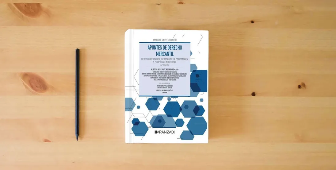 The book Apuntes de Derecho Mercantil: Derecho Mercantil, Derecho de la Competencia y Propiedad Industrial (Manuales)} is on the table