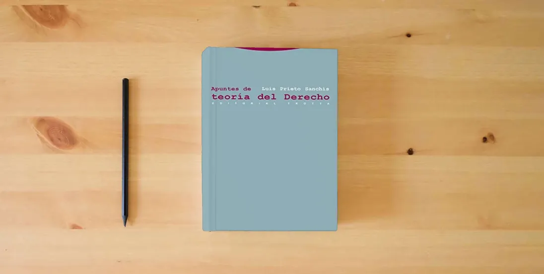 The book Apuntes De Teoría Del Derecho (ESTRUCTURAS Y PROCESOS - DERECHO)} is on the table