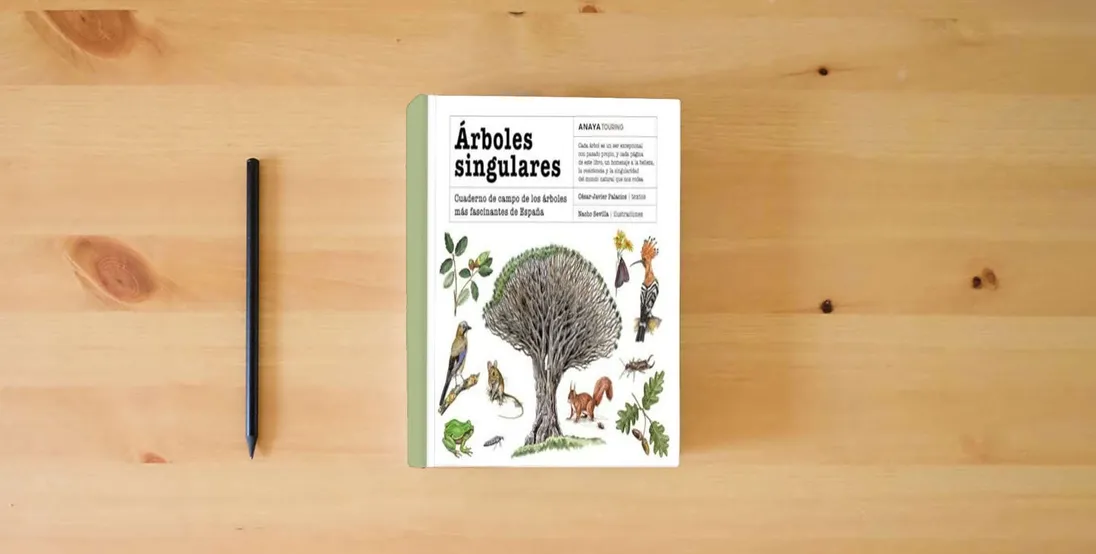The book Árboles singulares: Cuaderno de campo de los árboles más fascinantes de España (Guías Singulares)} is on the table