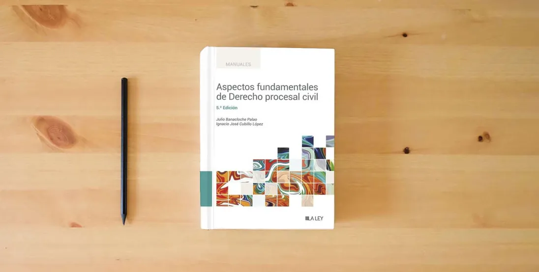 The book Aspectos fundamentales de Derecho procesal civil (5.ª edición) (MANUALES PROFESIONALES)} is on the table