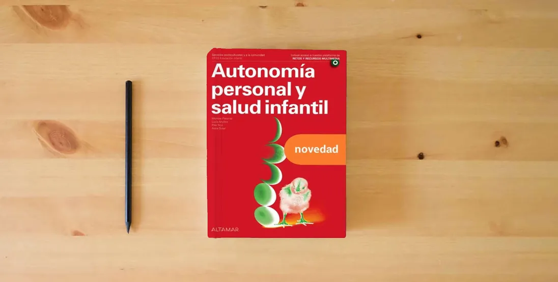 The book Autonomía personal y salud infantil. Nueva edición (CFGS EDUCACIÓN INFANTIL)} is on the table