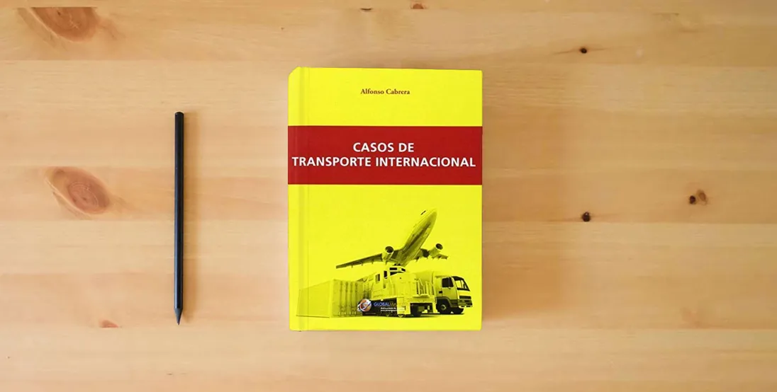 The book Casos De Transporte Internacional (ECONOMIA)} is on the table
