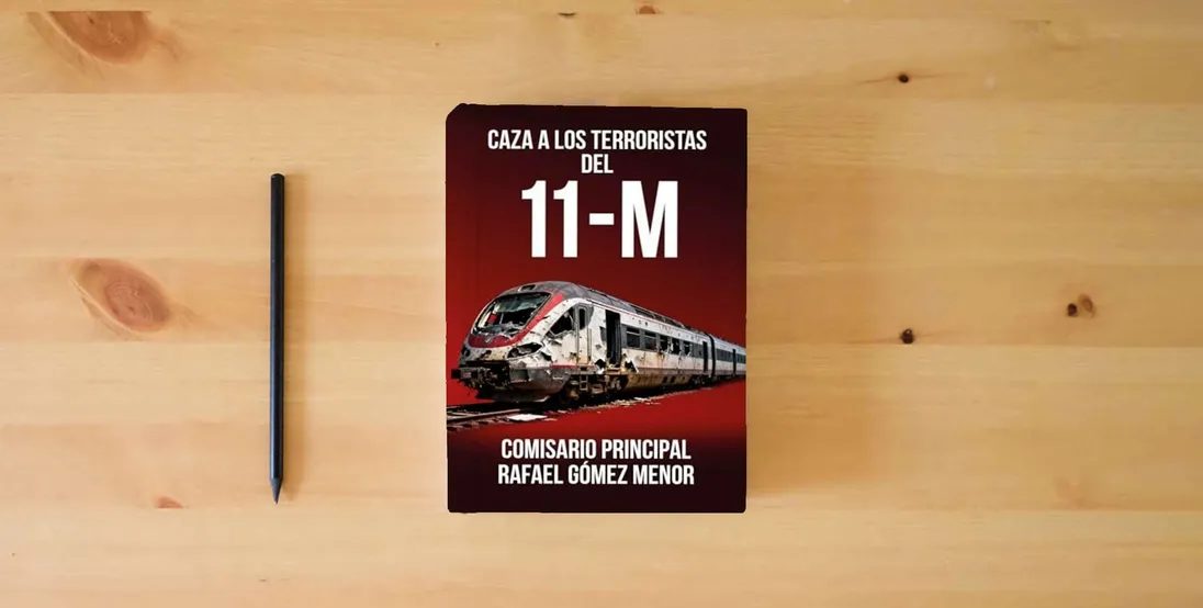 The book Caza a los terroristas del 11-M} is on the table