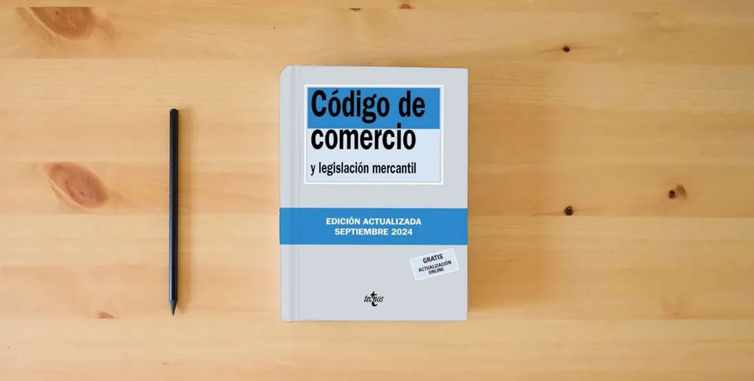 The book Código de Comercio: y legislación mercantil (Derecho - Biblioteca de Textos Legales)} is on the table