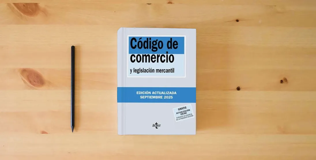 The book Código de Comercio: y legislación mercantil (Derecho - Biblioteca de Textos Legales)} is on the table