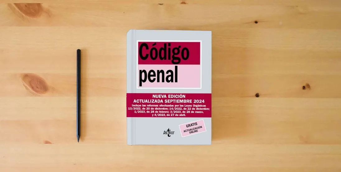 The book Código Penal: Ley Orgánica 10/1995, de 23 de noviembre (Derecho - Biblioteca de Textos Legales)} is on the table