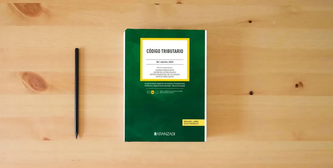 The book Código Tributario: 9 (Código Básico)} is on the table