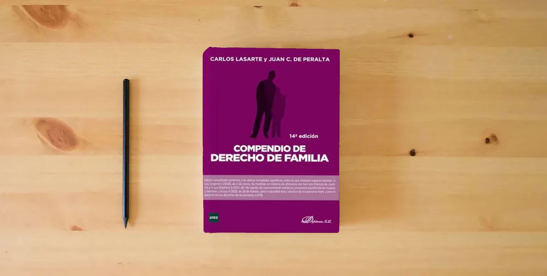 The book Compendio de Derecho de Familia} is on the table