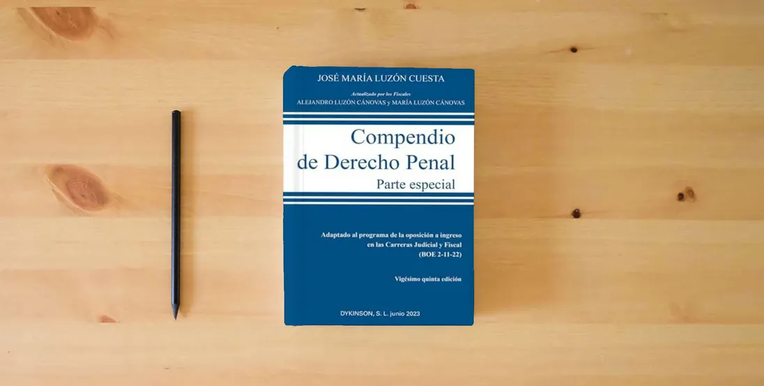 The book Compendio de Derecho Penal. Parte Especial. Edición 2023 (SIN COLECCION)} is on the table