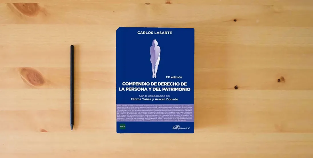 The book Compendio de Derecho de la Persona y del Patrimonio} is on the table