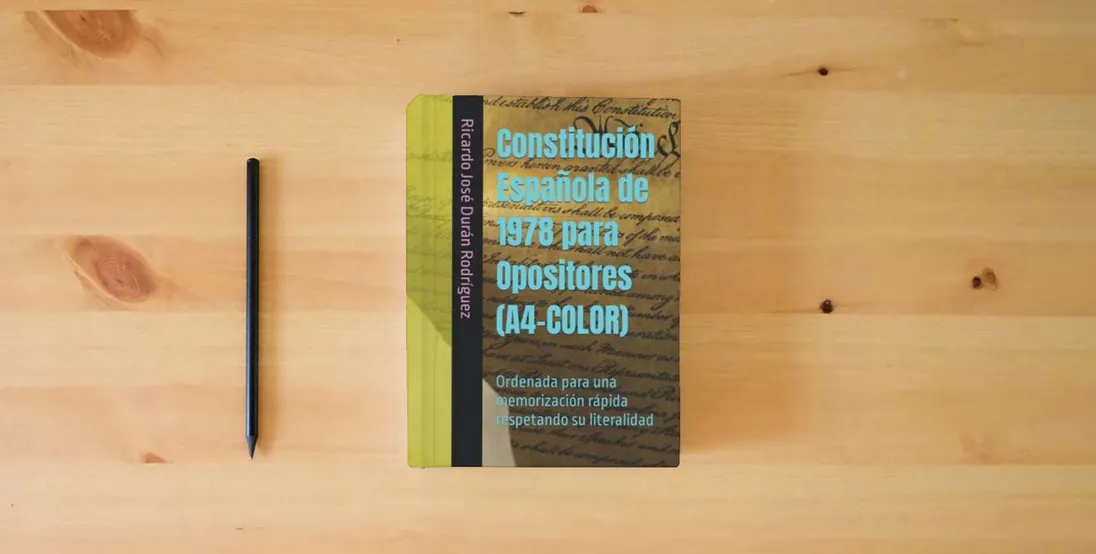 The book Constitución Española de 1978 para Opositores (A4-COLOR): Ordenada para una memorización rápida respetando su literalidad} is on the table