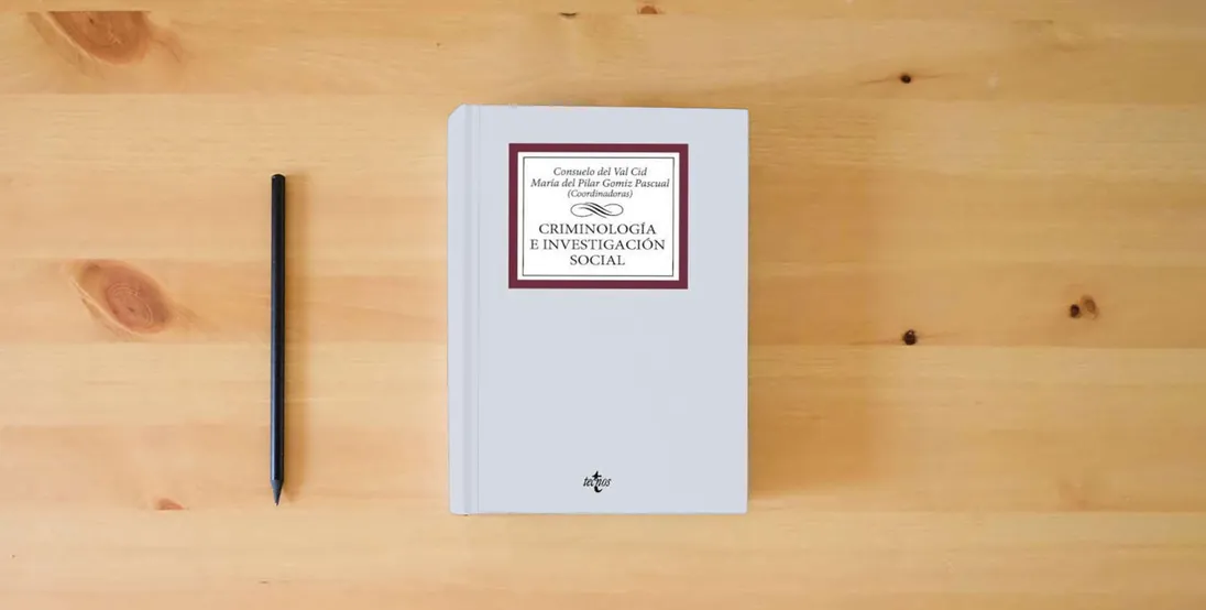 The book Criminología e investigación social (Sociología)} is on the table
