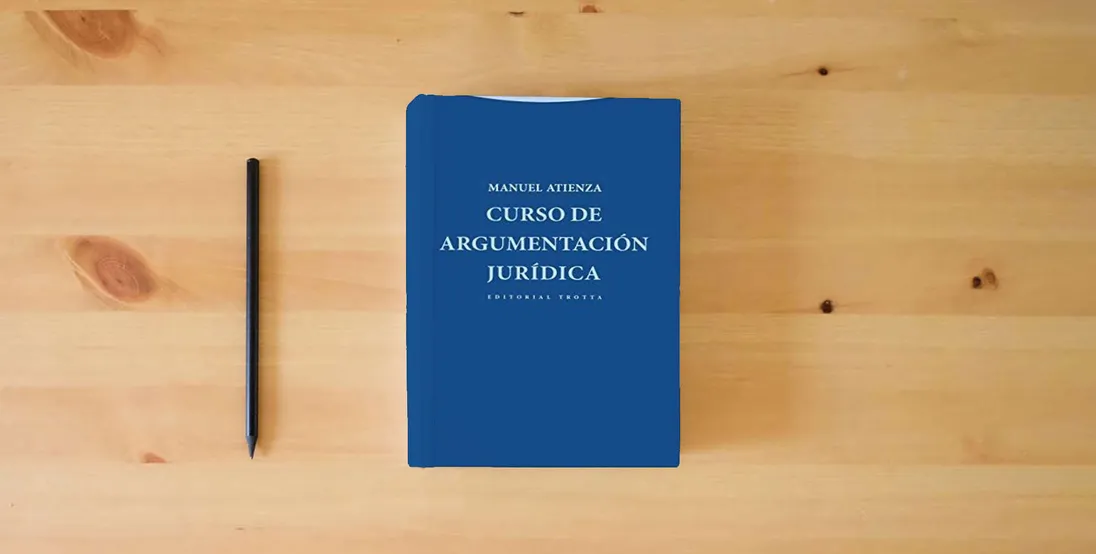 The book Curso De Argumentación Jurídica - 2ª Edición (Estructuras Y Procesos. Derecho)} is on the table