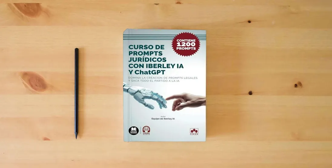The book Curso de prompts jurídicos con Iberley IA y ChatGPT: Domina la creación de prompts legales y saca todo el partido a la IA. Contiene más de 1.200 prompts (Bolsillo)} is on the table