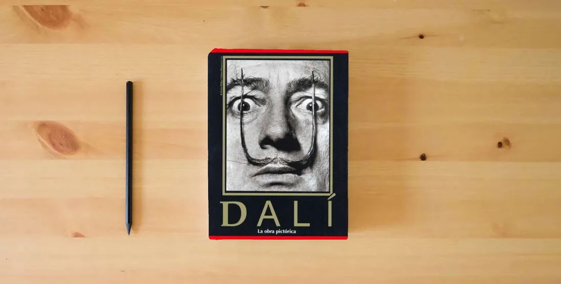 The book Dali: The Paintings} is on the table
