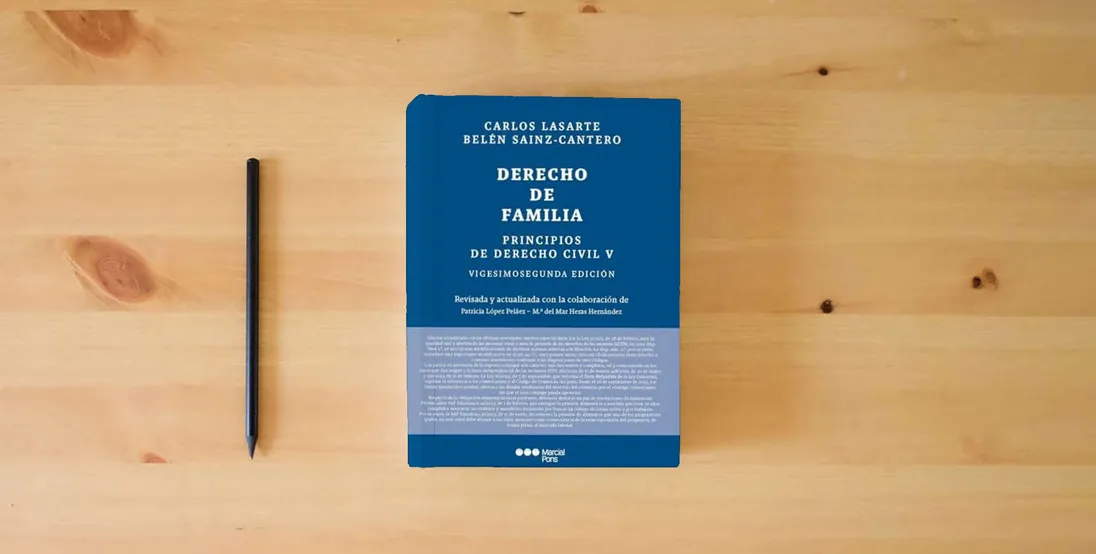 The book DERECHO DE FAMILIA} is on the table