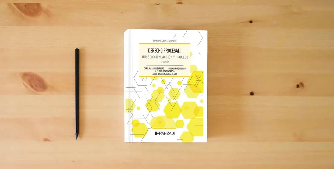The book Derecho Procesal I: Jurisdicción, acción y proceso (Manuales)} is on the table