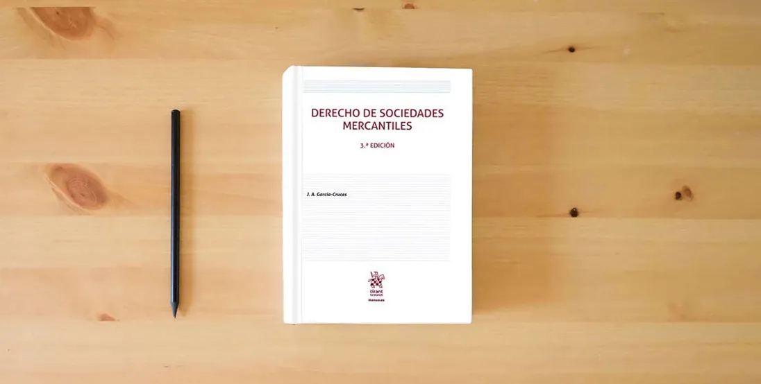 The book Derecho de Sociedades Mercantiles 3ª Edición (Manuales de Derecho Civil y Mercantil)} is on the table