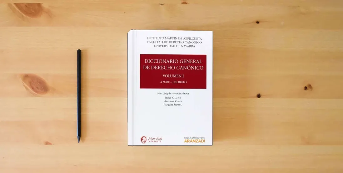 The book Diccionario General de Derecho Canónico (Tomos I a VII)} is on the table
