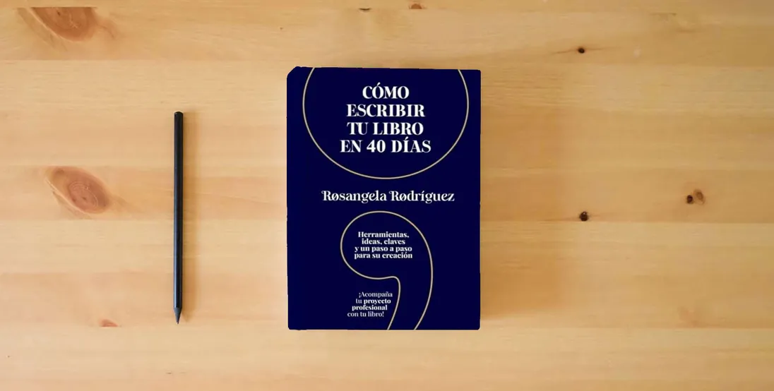 The book Cómo escribir tu libro en 40 días: Herramientas, ideas, claves y un paso a paso para su creación (Escribe tu libro)} is on the table