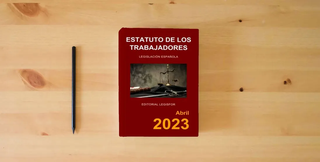 The book Estatuto de los Trabajadores} is on the table