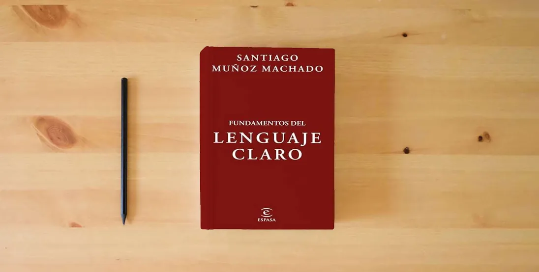 The book Fundamentos del lenguaje claro (NO FICCIÓN)} is on the table