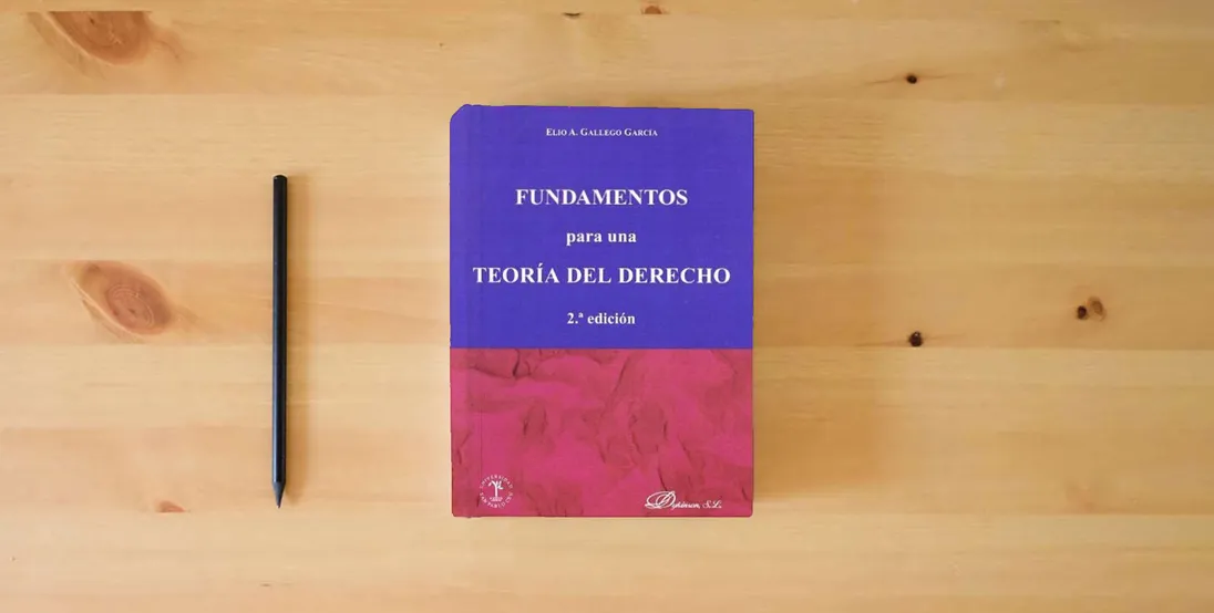 The book Fundamentos Para Una Teoría Del Derecho 2ª Edición (SIN COLECCION)} is on the table